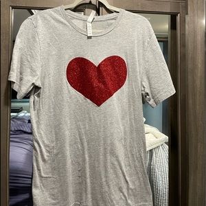 A nice long t shirt with a heart on it.